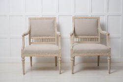 Genuine antique gustavian armchairs from Sweden made during the late 1700s. This pair of chairs have been scraped to the original paint