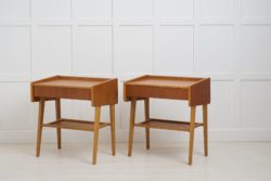 Vintage Scandinavian teak nightstands, with a single drawer and shelf underneath. The pair is made in Sweden around 1960. Good vintage condition