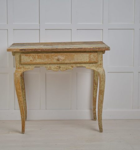 Genuine antique rococo table from Sweden. A country house furniture from the late 1700s made by hand in solid pine