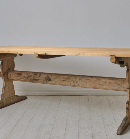 Large antique dining table, a so called trestle table, from the early 1800s. The table is made in solid pine in northern Sweden around 1820