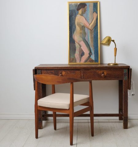 Antique Swedish Grace desk by Otto Wretling made in northern Sweden around 1915. The desk has a frame in pine with a hand carved decor