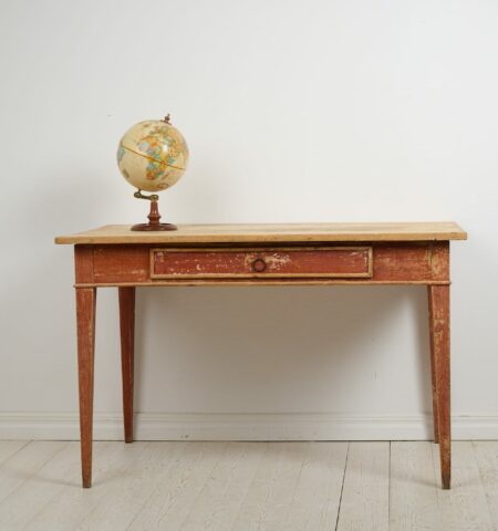 Antique Swedish rustic desk from the early 1800s. The desk is a large, classic country house furniture in gustavian style with straight tapered legs and a large drawer.