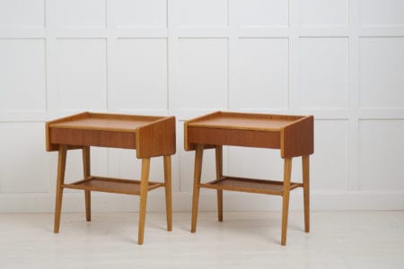 Vintage Scandinavian teak nightstands, with a single drawer and shelf underneath. The pair is made in Sweden around 1960. Good vintage condition