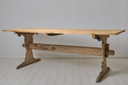 Large antique dining table, a so called trestle table, from the early 1800s. The table is made in solid pine in northern Sweden around 1820