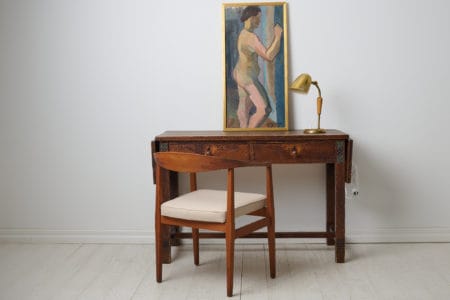 Antique Swedish Grace desk by Otto Wretling made in northern Sweden around 1915. The desk has a frame in pine with a hand carved decor