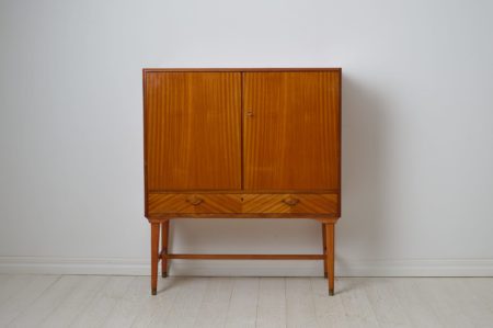 Swedish modern vintage cabinet from the mid 20th century. Made in Sweden and veneered with mahogany