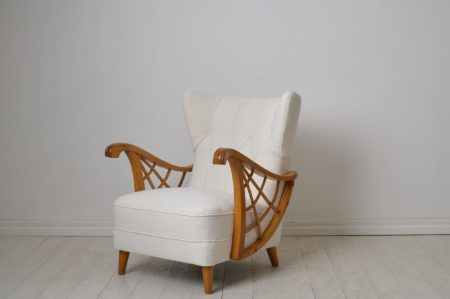 Swedish modern white armchair from the mid 20th century, around 1940 to 1950. Newly renovated with new padding and upholstery.